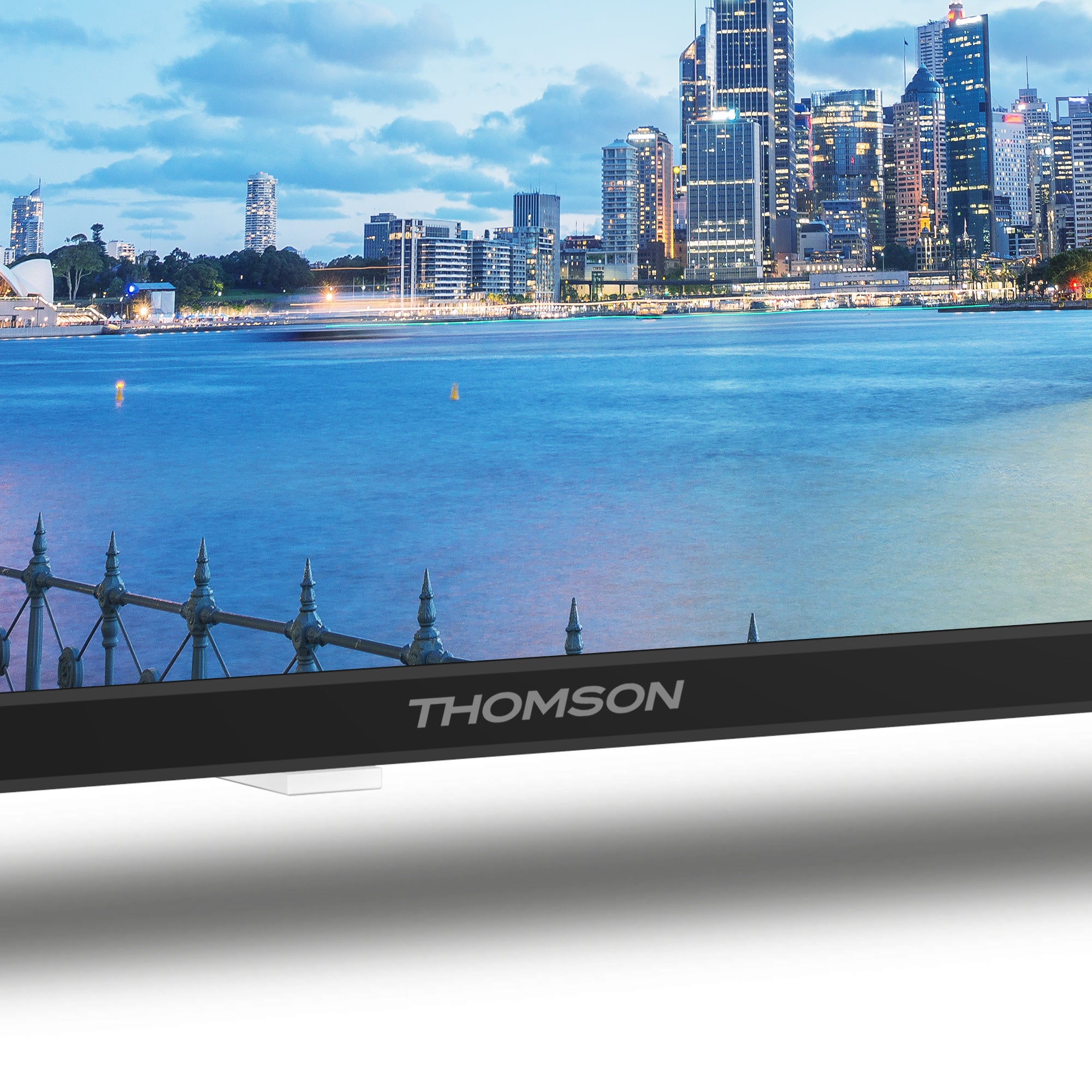 Thomson TV with a city skyline and waterfront in the background