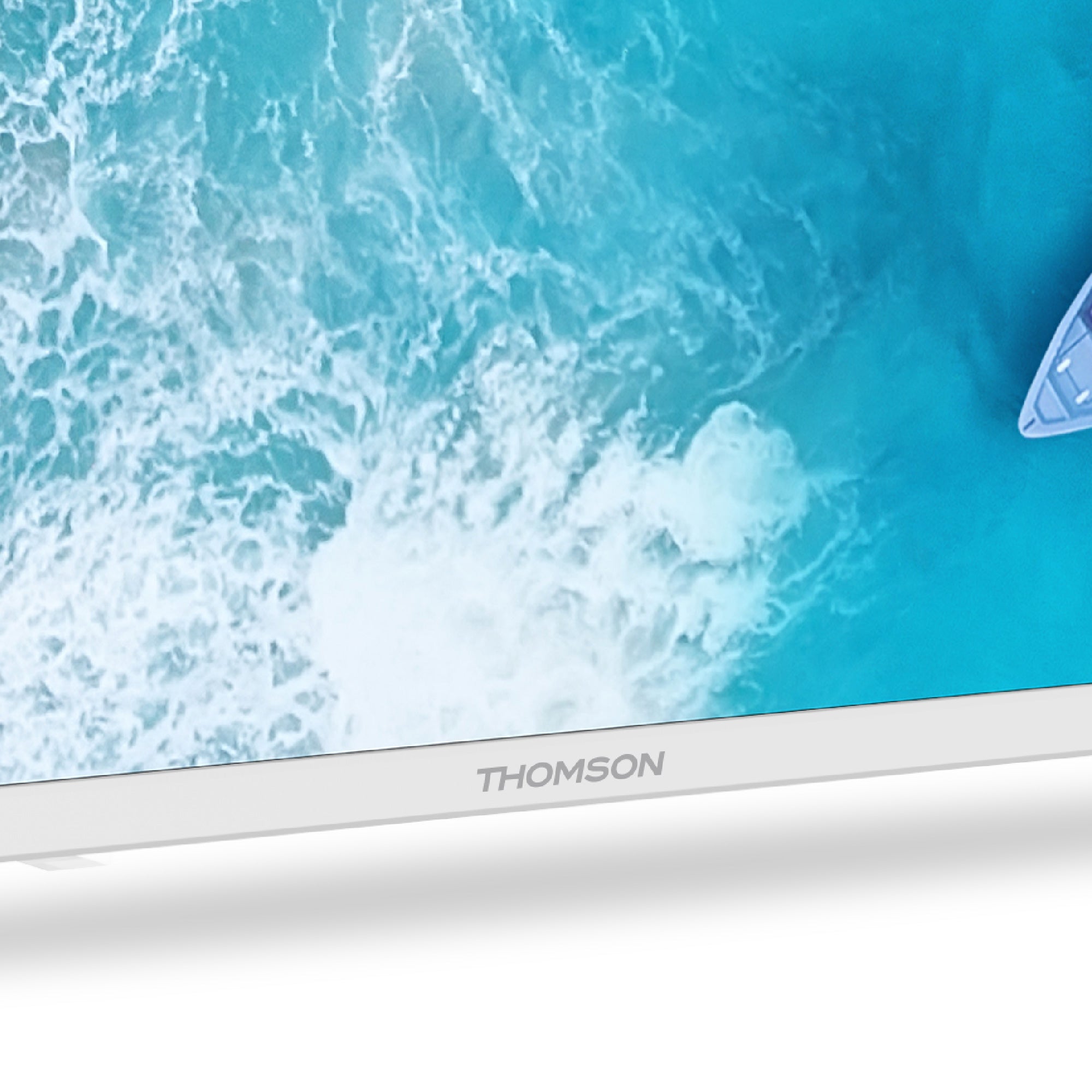 Close-up of a Thomson television with a blue screen displaying ocean waves.