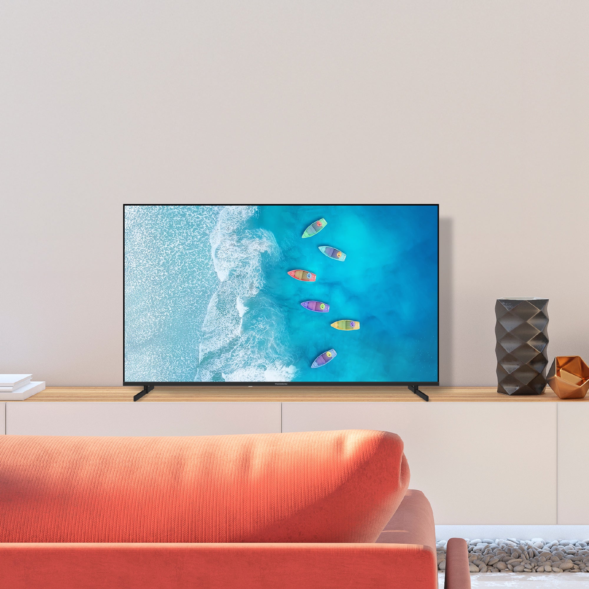 TV displaying an ocean scene with boats in a modern living room.