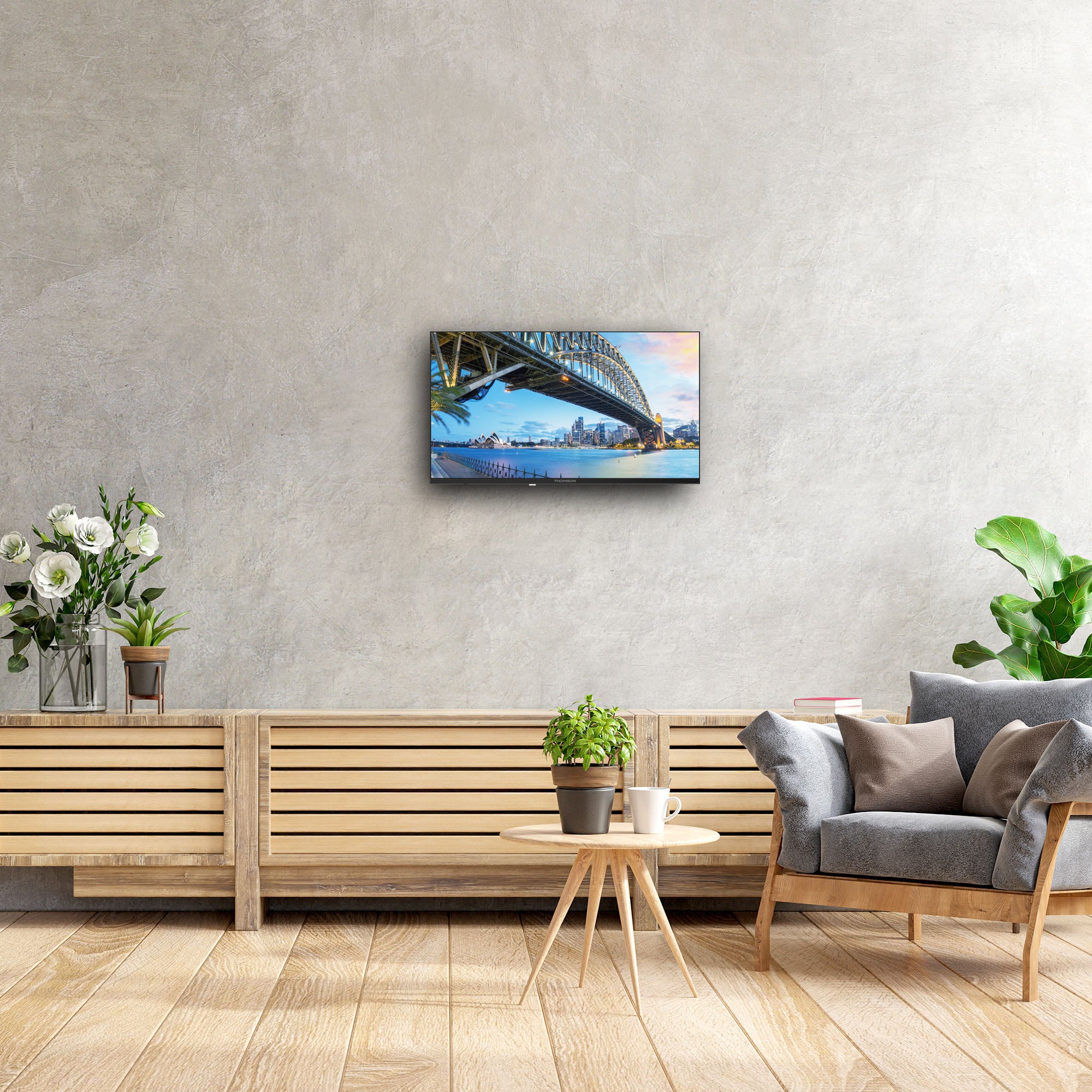 Living room with a TV displaying a bridge, wooden bench, and decorative items.