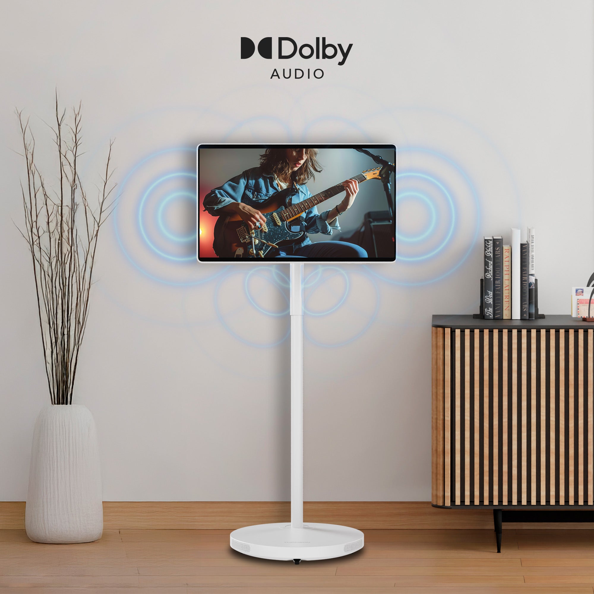 White floor-standing speaker with Dolby Audio branding in a room setting.