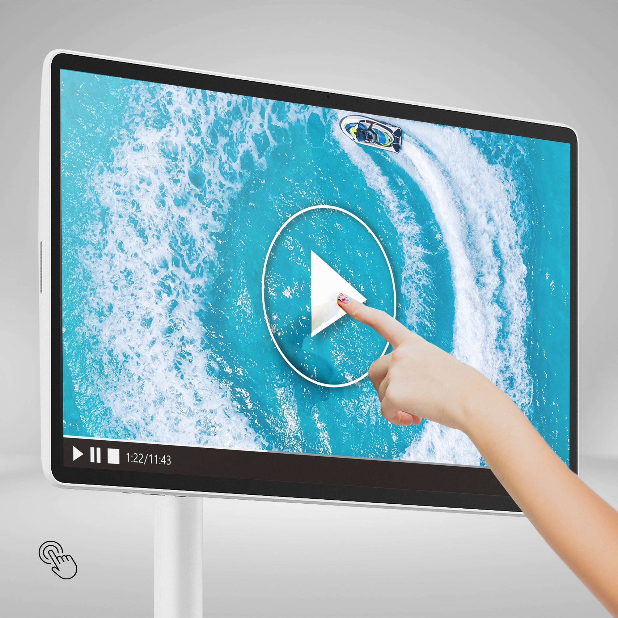 Hand interacting with a digital screen displaying an ocean scene with people and a play button.